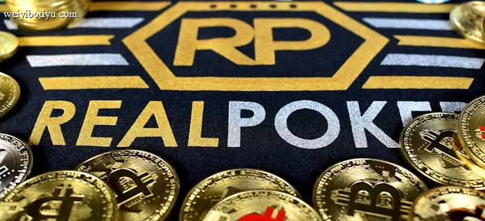 Stacks of poker chips in various colors are arranged in the background, while in the foreground, there are numerous golden coins featuring the Bitcoin symbol. The text 'REALPOKER' is prominently displayed in gold and silver lettering on a dark background.